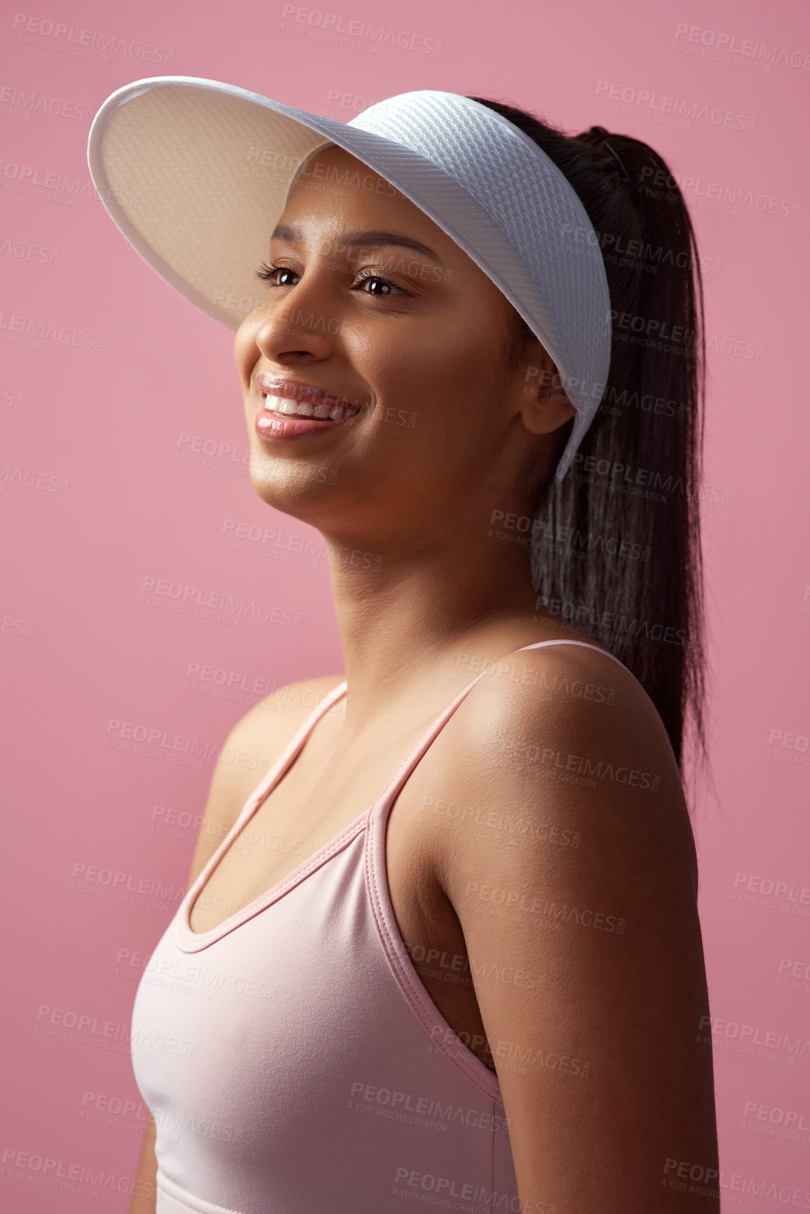 Buy stock photo Cropped shot of an attractive and sporty young woman posing in studio against a pink background