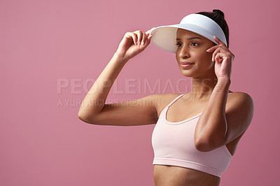 Buy stock photo Cropped shot of an attractive and sporty young woman posing in studio against a pink background