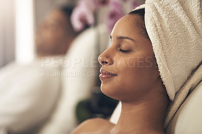 Buy stock photo Shot of a woman wearing a towel around her head while enjoying a spa day