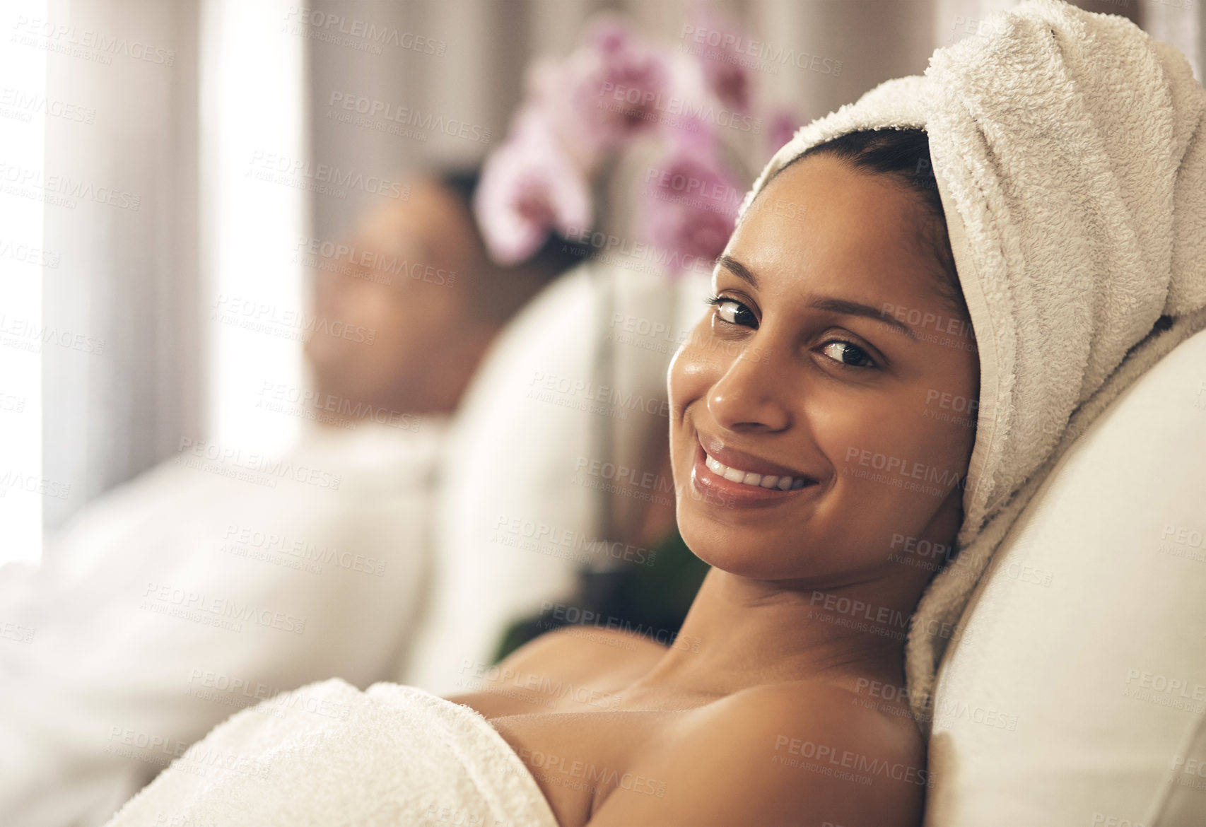 Buy stock photo Shot of a woman wearing a towel around her head while enjoying a spa day