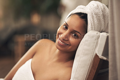 Buy stock photo Shot of a woman wearing a towel around her head while enjoying a spa day