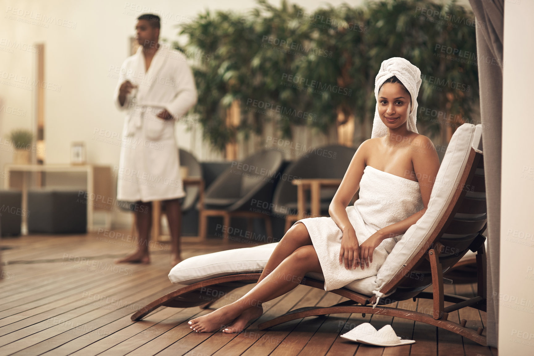 Buy stock photo Shot of a woman wearing a towel around her head while enjoying a spa day