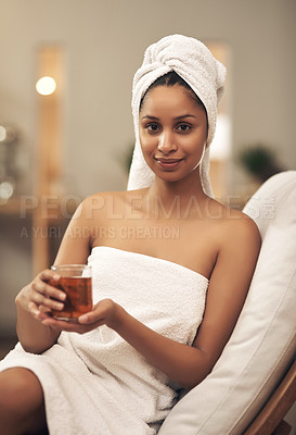 Buy stock photo Shot of a woman drinking tea while enjoying a spa day