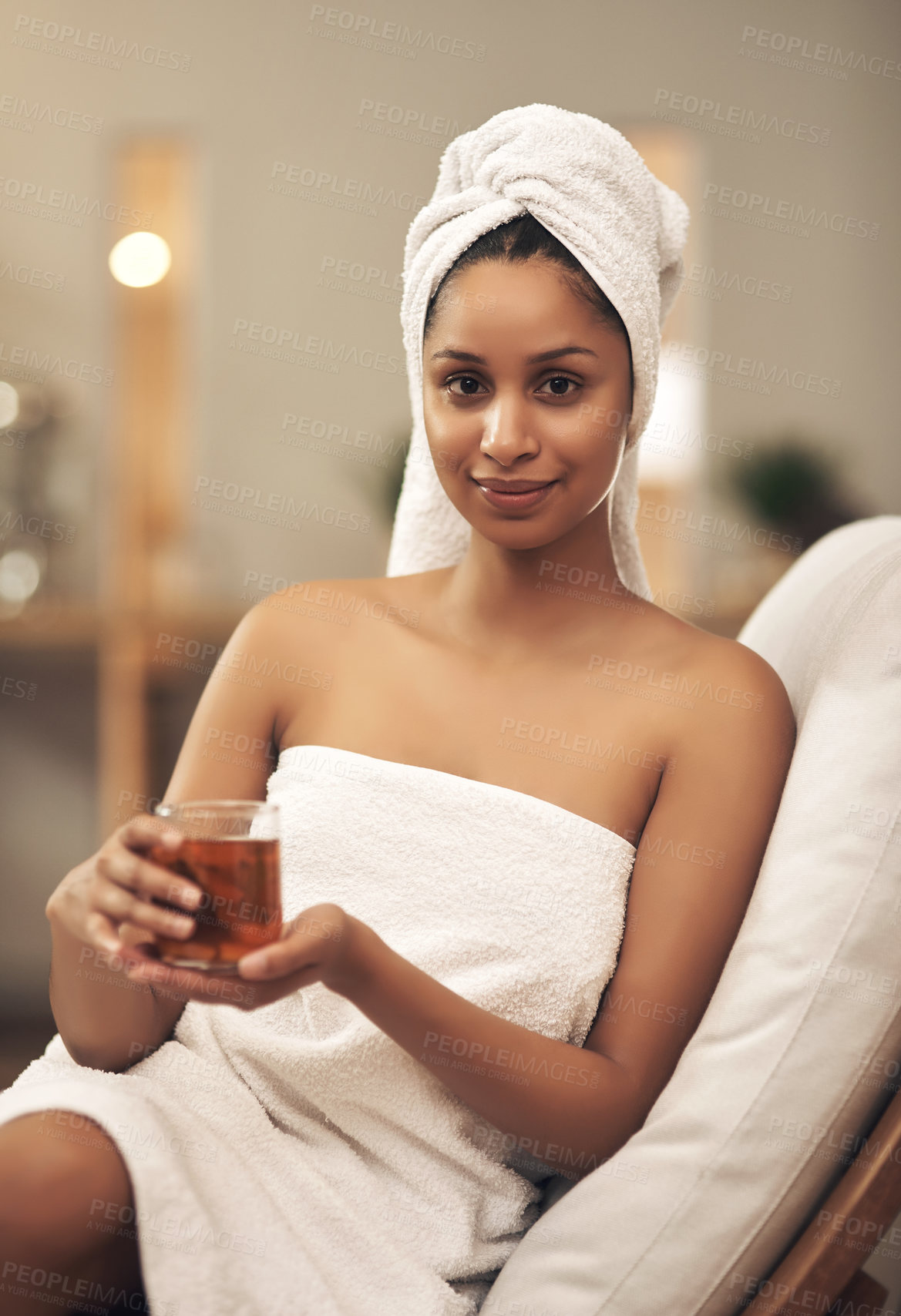 Buy stock photo Shot of a woman drinking tea while enjoying a spa day