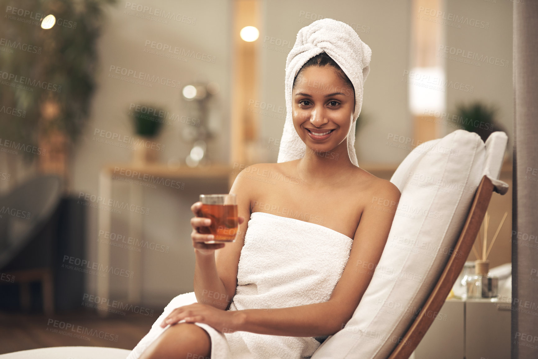 Buy stock photo Shot of a woman drinking tea while enjoying a spa day