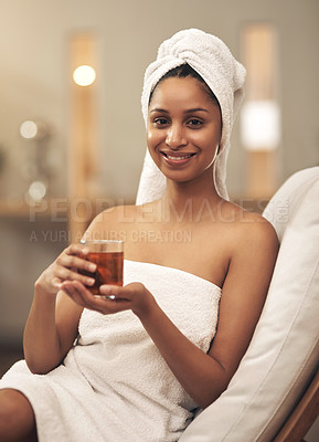 Buy stock photo Shot of a woman drinking tea while enjoying a spa day