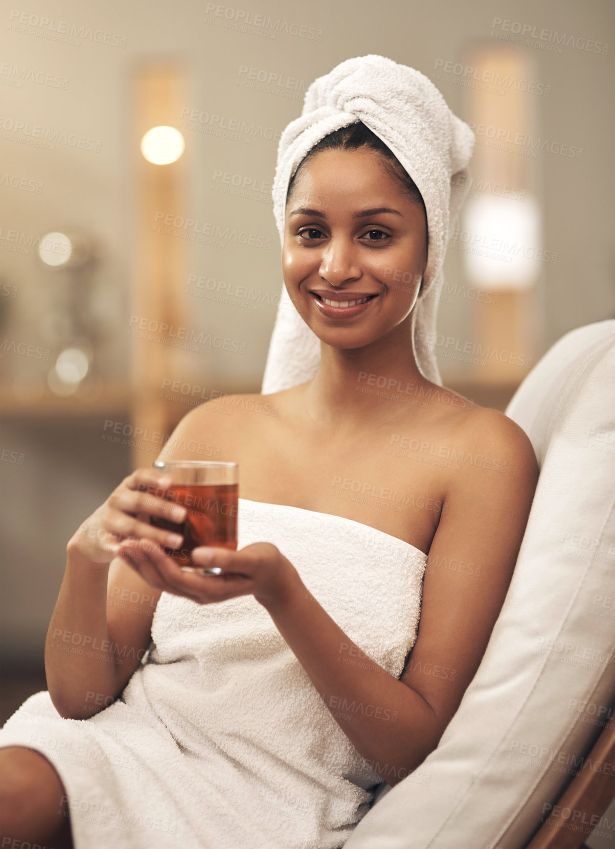 Buy stock photo Shot of a woman drinking tea while enjoying a spa day