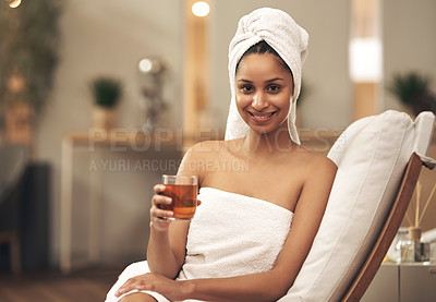 Buy stock photo Shot of a woman drinking tea while enjoying a spa day