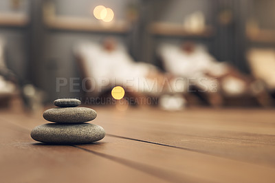 Buy stock photo Shot of three stones balanced on top of each other in a spa