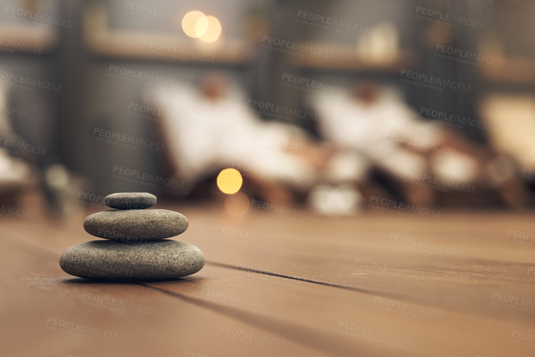 Buy stock photo Shot of three stones balanced on top of each other in a spa