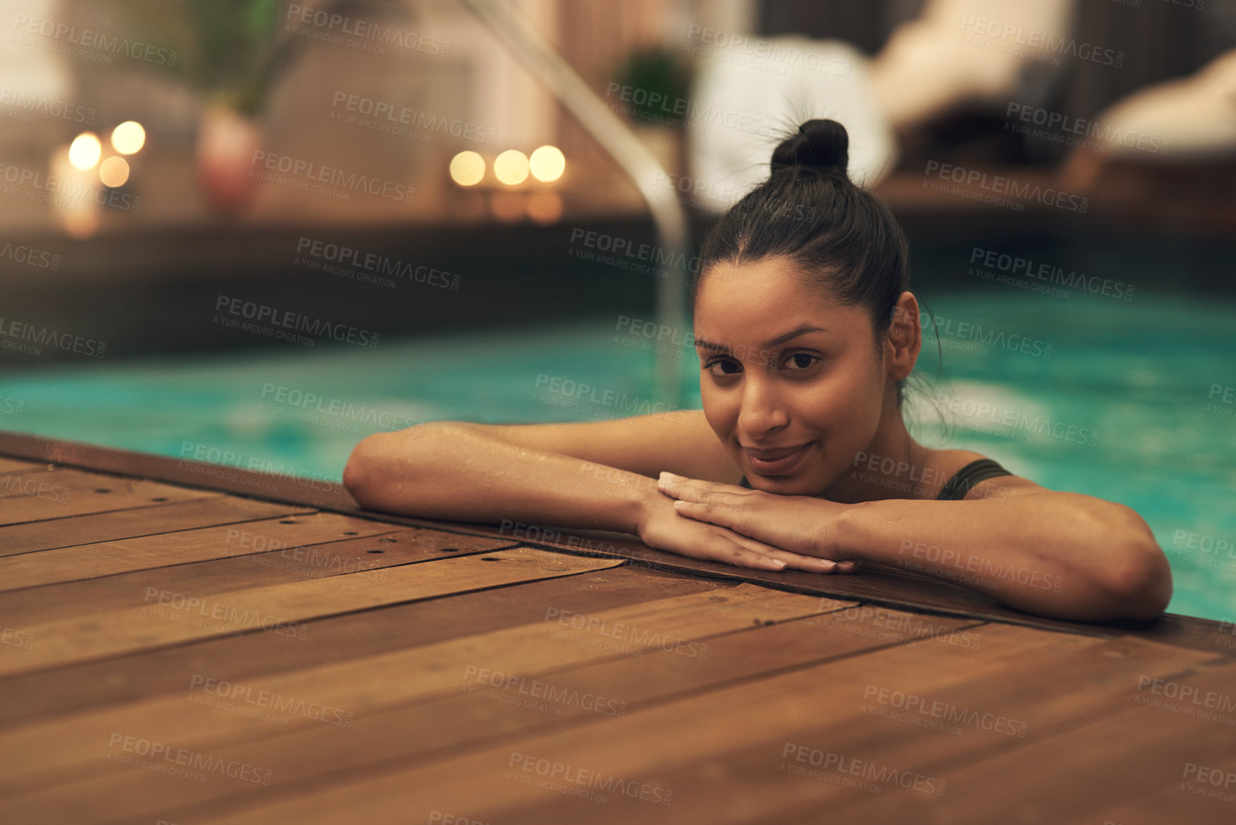 Buy stock photo Shot of a young woman relaxing in a pool at a spa