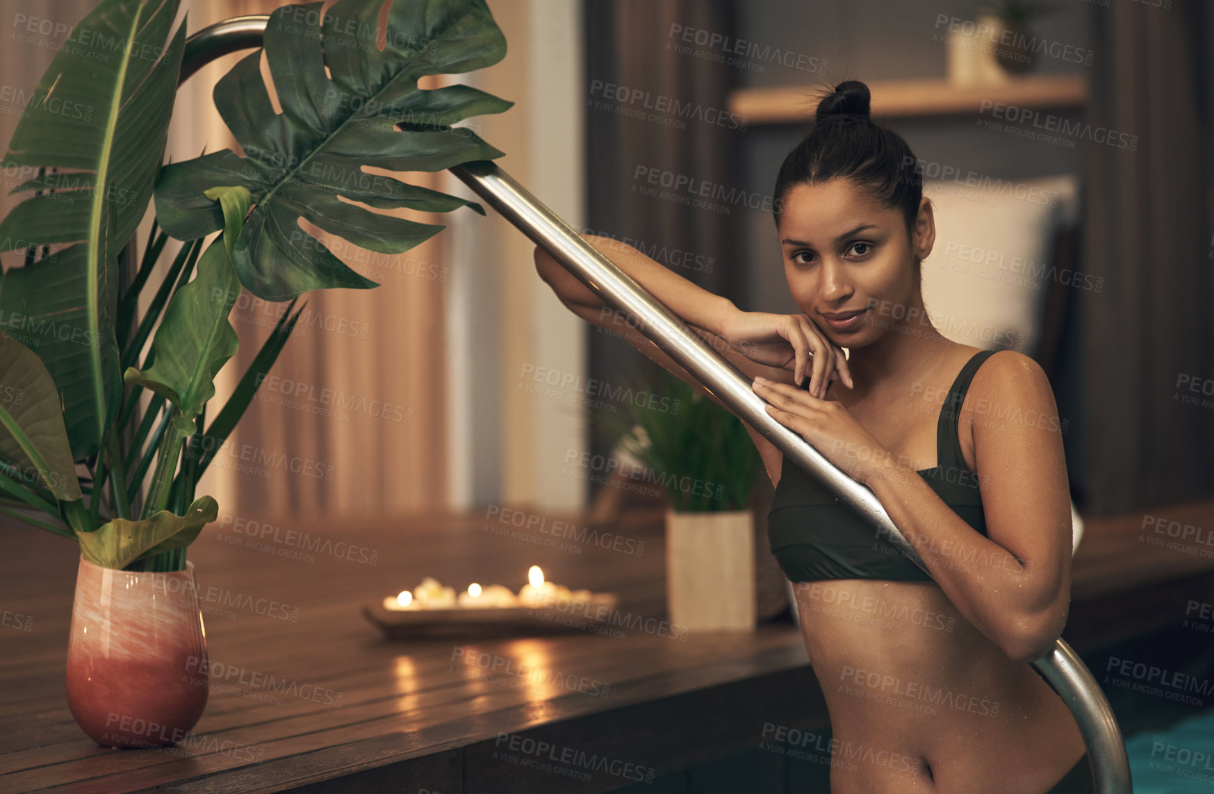 Buy stock photo Shot of a young woman relaxing in a pool at a spa