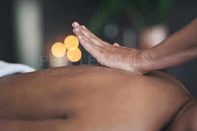 Buy stock photo Closeup shot of an unrecognisable woman getting a back massage at a spa