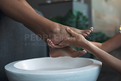 Buy stock photo Closeup shot of an unrecognisable woman getting a foot treatment at a spa