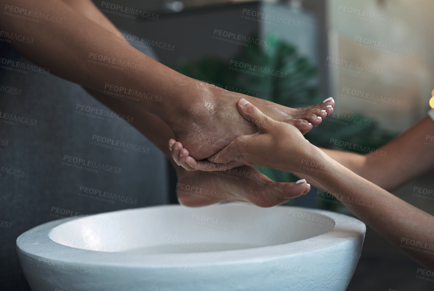 Buy stock photo Closeup shot of an unrecognisable woman getting a foot treatment at a spa