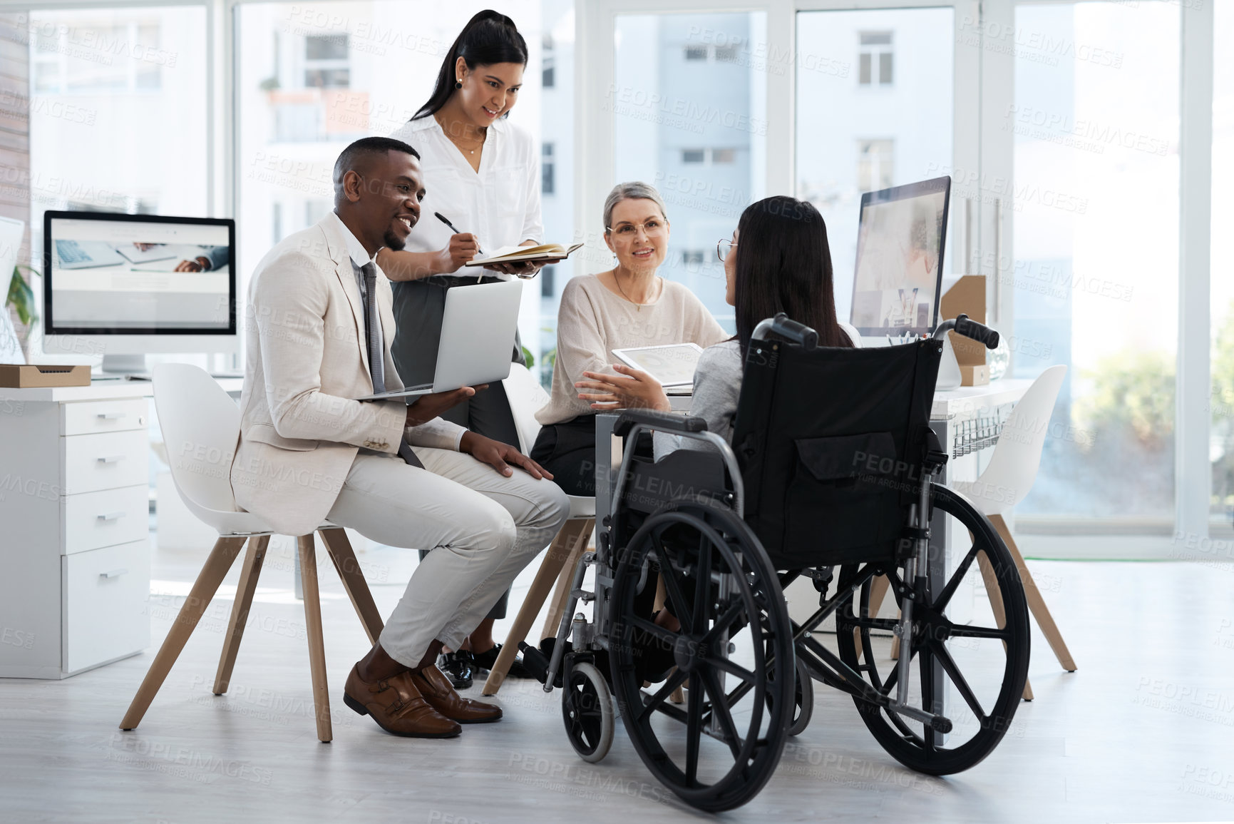 Buy stock photo Full length shot of a group of diverse businesspeople having an informal meeting in their office
