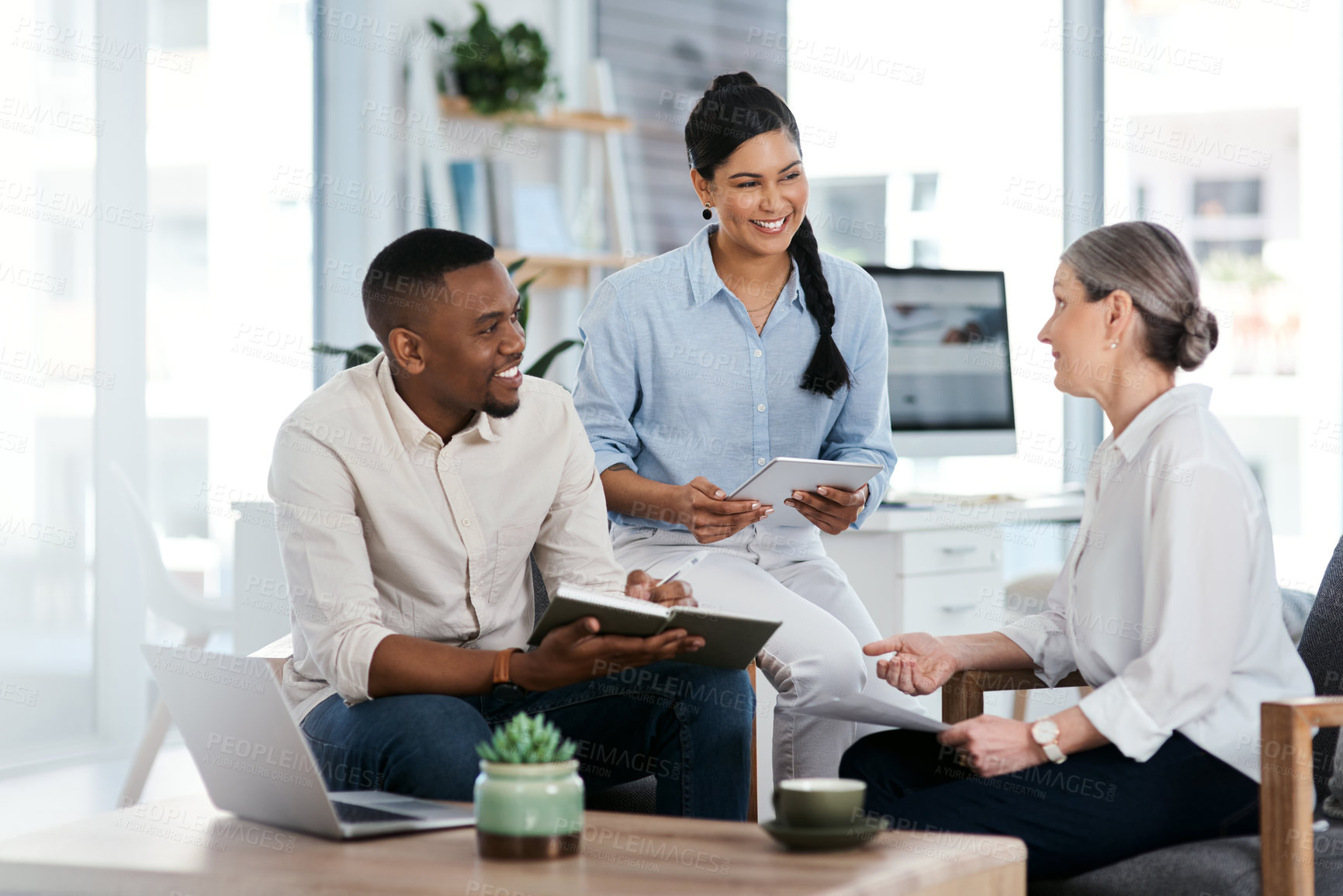 Buy stock photo Shot of a group of businesspeople having a discussion in an office