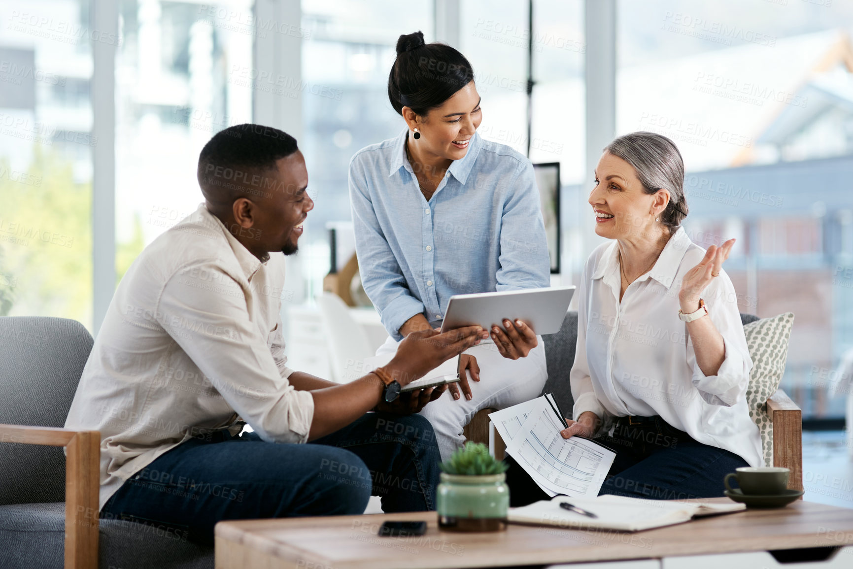 Buy stock photo Shot of a group of businesspeople working together in an office