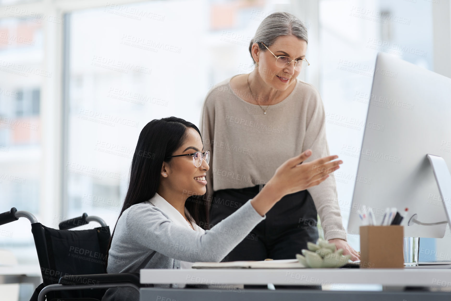 Buy stock photo Cropped shot of an attractive young businesswoman getting some information from her human resources manager in the office