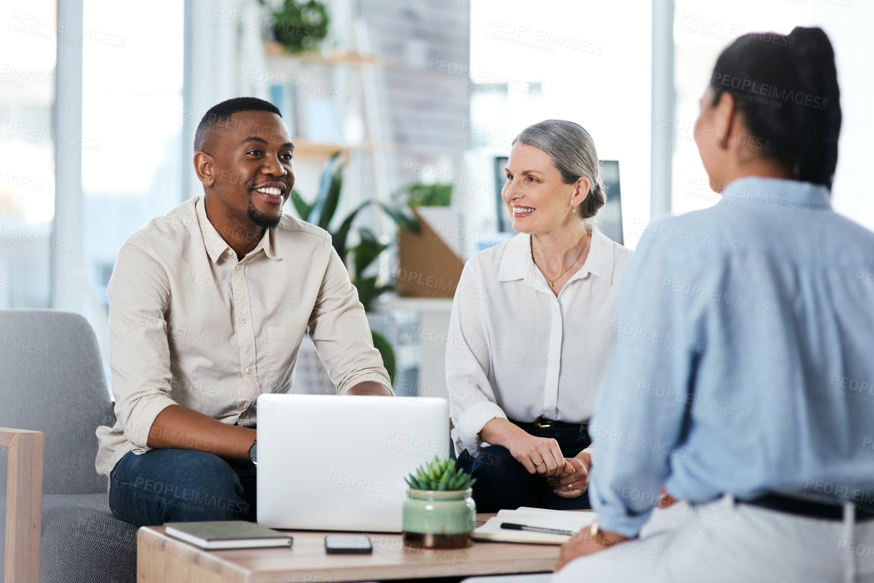 Buy stock photo Shot of a group of businesspeople having a discussion in an office