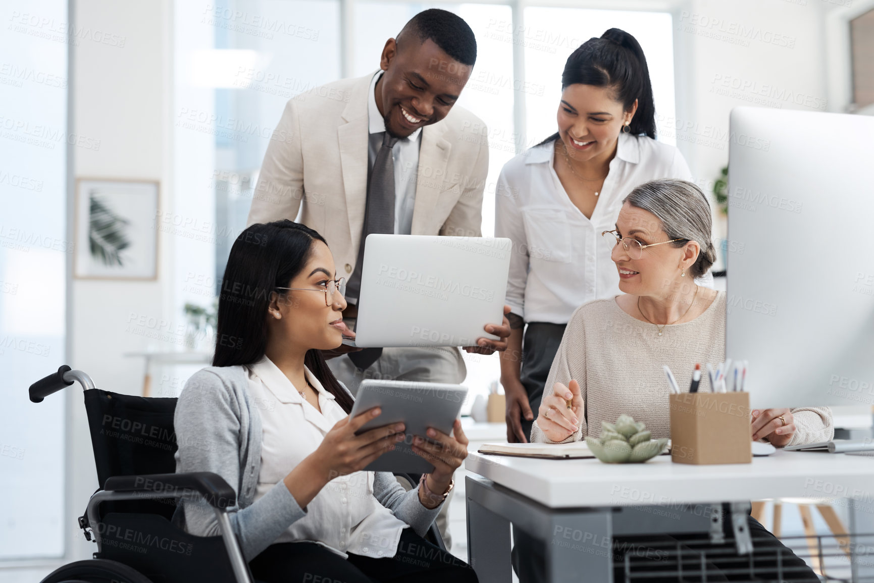Buy stock photo Cropped shot of a group of diverse businesspeople having an informal meeting in their office