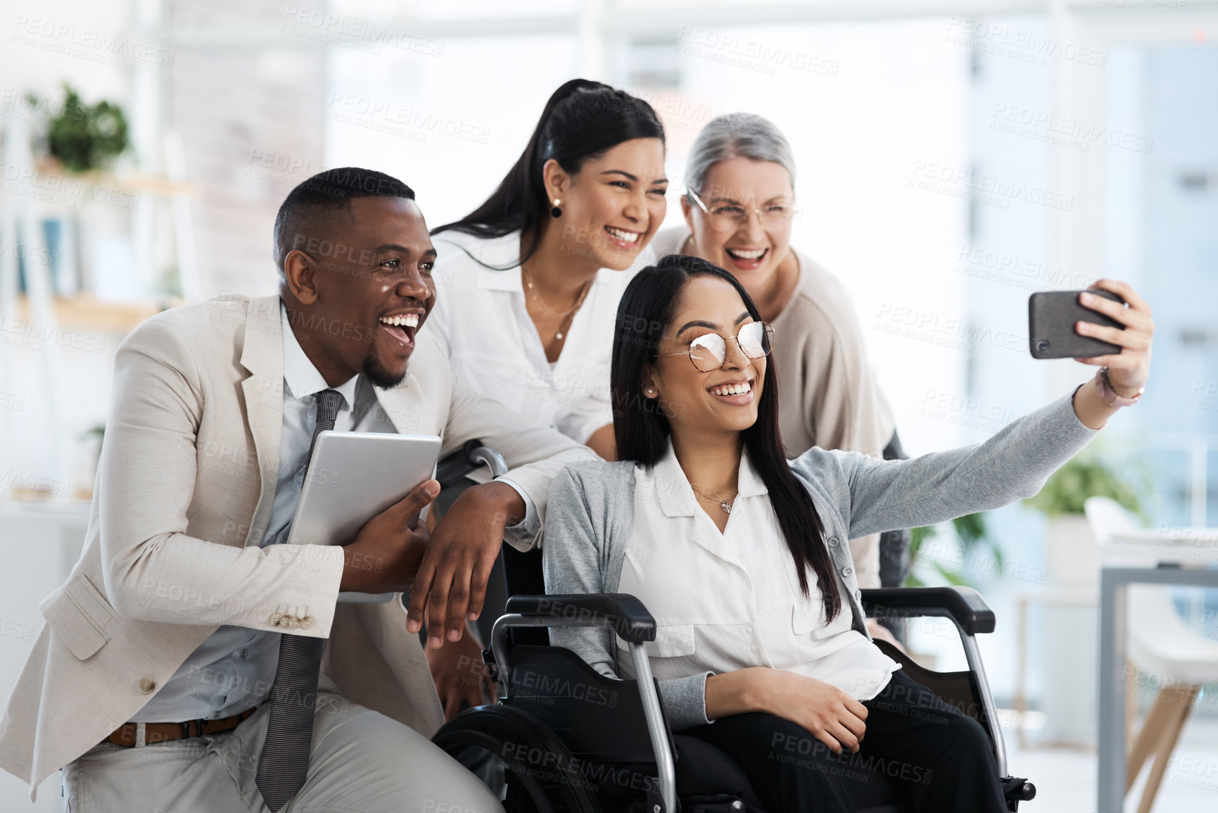 Buy stock photo Cropped shot of a group of diverse businesspeople taking selfies while gathered in their office