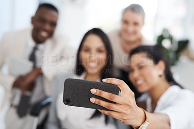 Buy stock photo Cropped shot of a group of diverse businesspeople taking selfies while gathered in their office