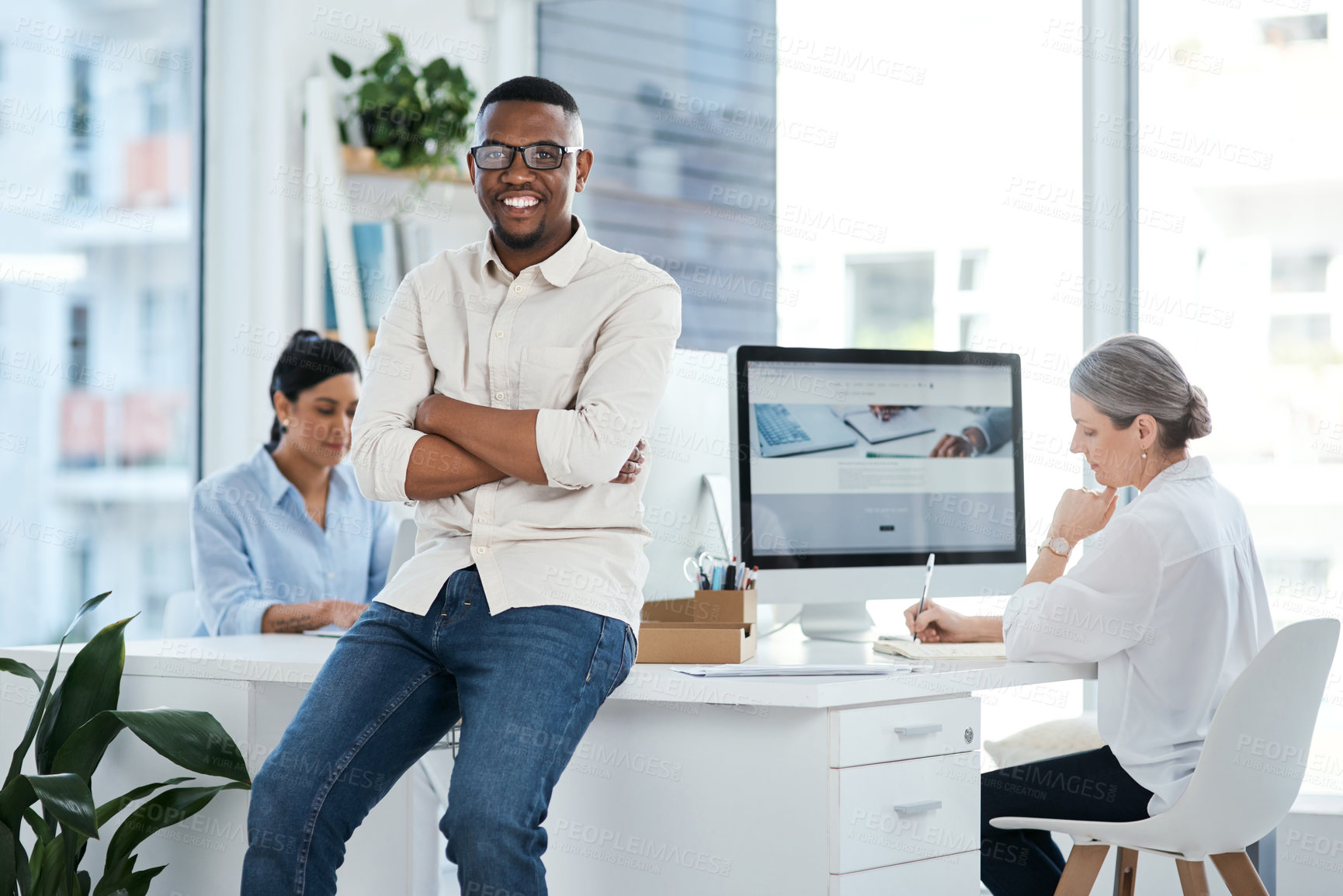 Buy stock photo Portrait of a confident young businessman standing in an office