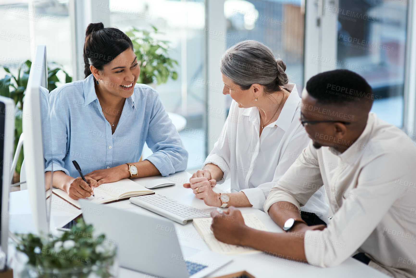 Buy stock photo Shot of a group of businesspeople working together in an office