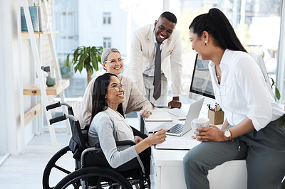 Buy stock photo Cropped shot of a group of diverse businesspeople having an informal meeting in their office