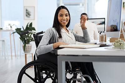 Buy stock photo Cropped portrait of an attractive young businesswoman working at her desk in the office