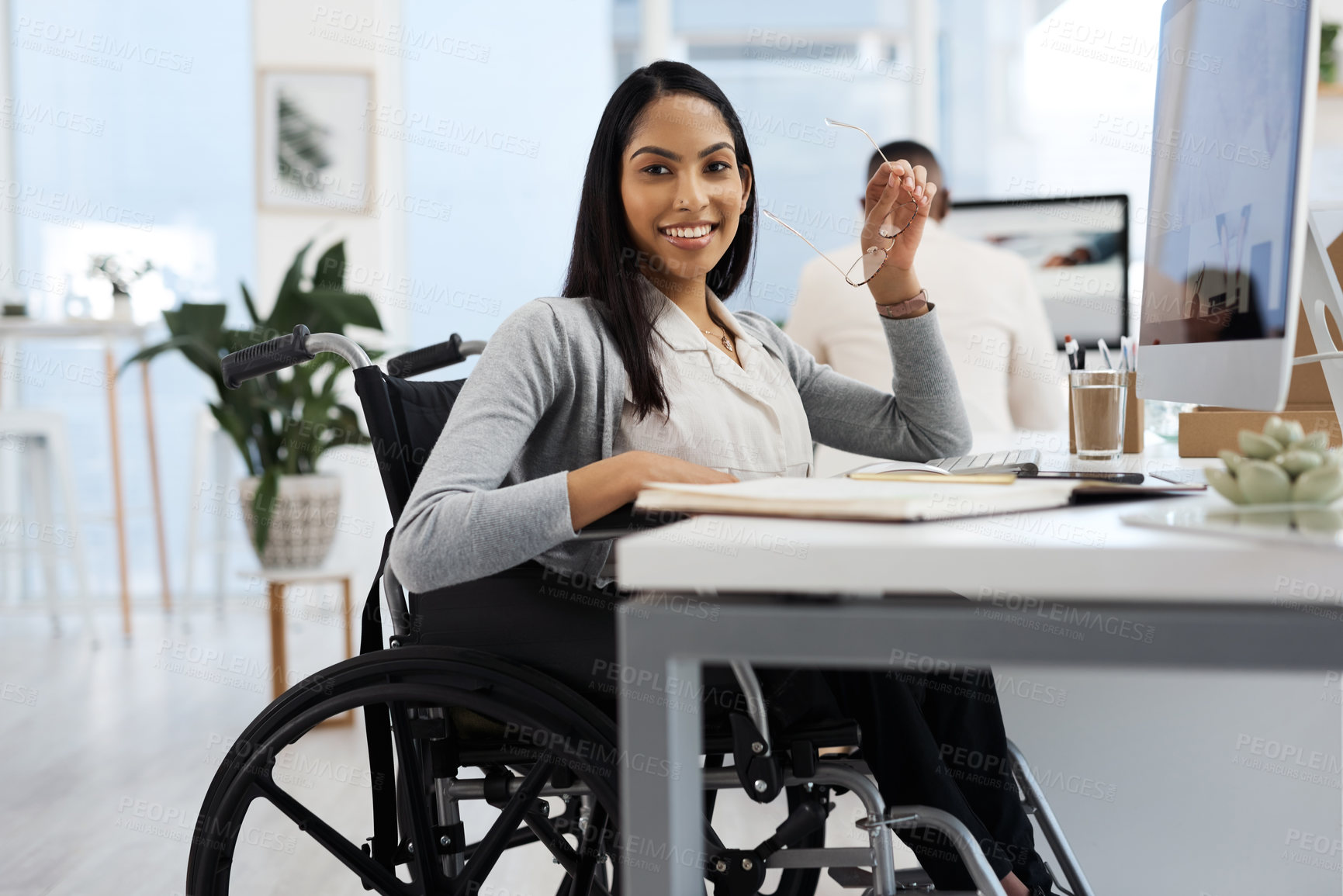 Buy stock photo Cropped portrait of an attractive young businesswoman working at her desk in the office