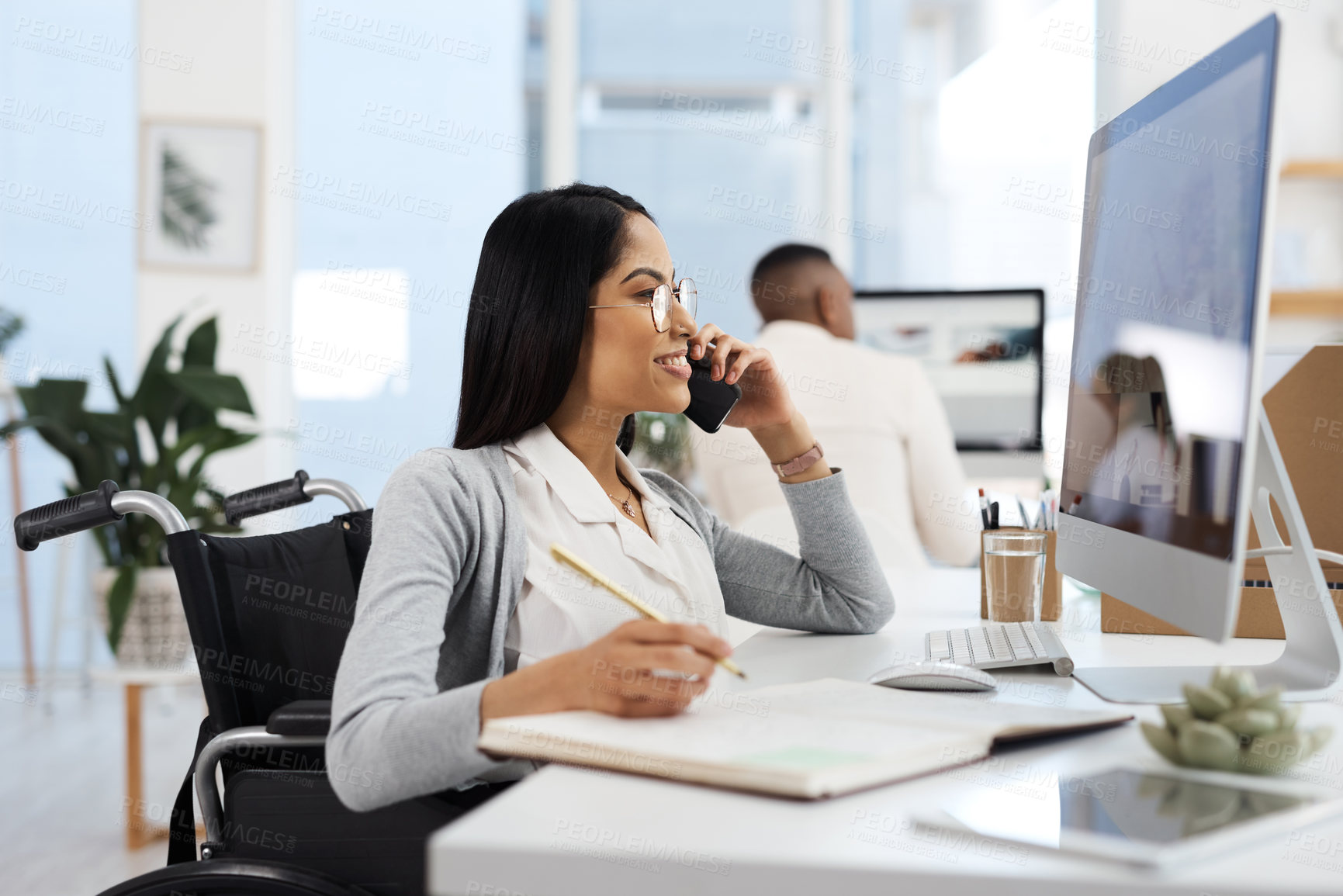 Buy stock photo Cropped shot of an attractive young businesswoman making a phonecall while working at her desk in the office