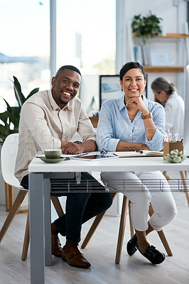 Buy stock photo Portrait of two businesspeople working together in an office