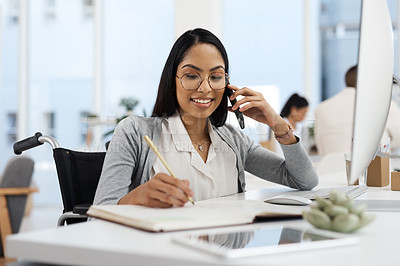 Buy stock photo Cropped shot of an attractive young businesswoman making a phonecall while working at her desk in the office