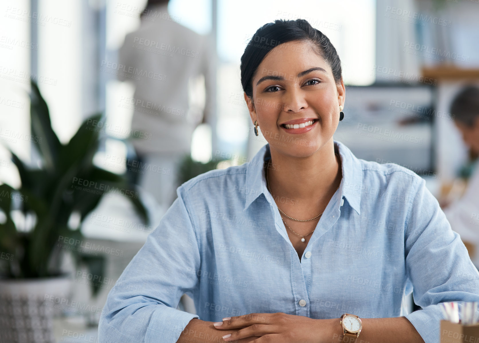 Buy stock photo Portrait of a confident young businesswoman working in an office