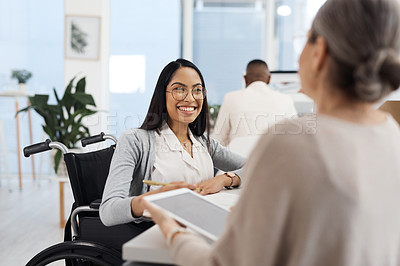 Buy stock photo Cropped shot of an attractive young businesswoman getting some information from her human resources manager in the office