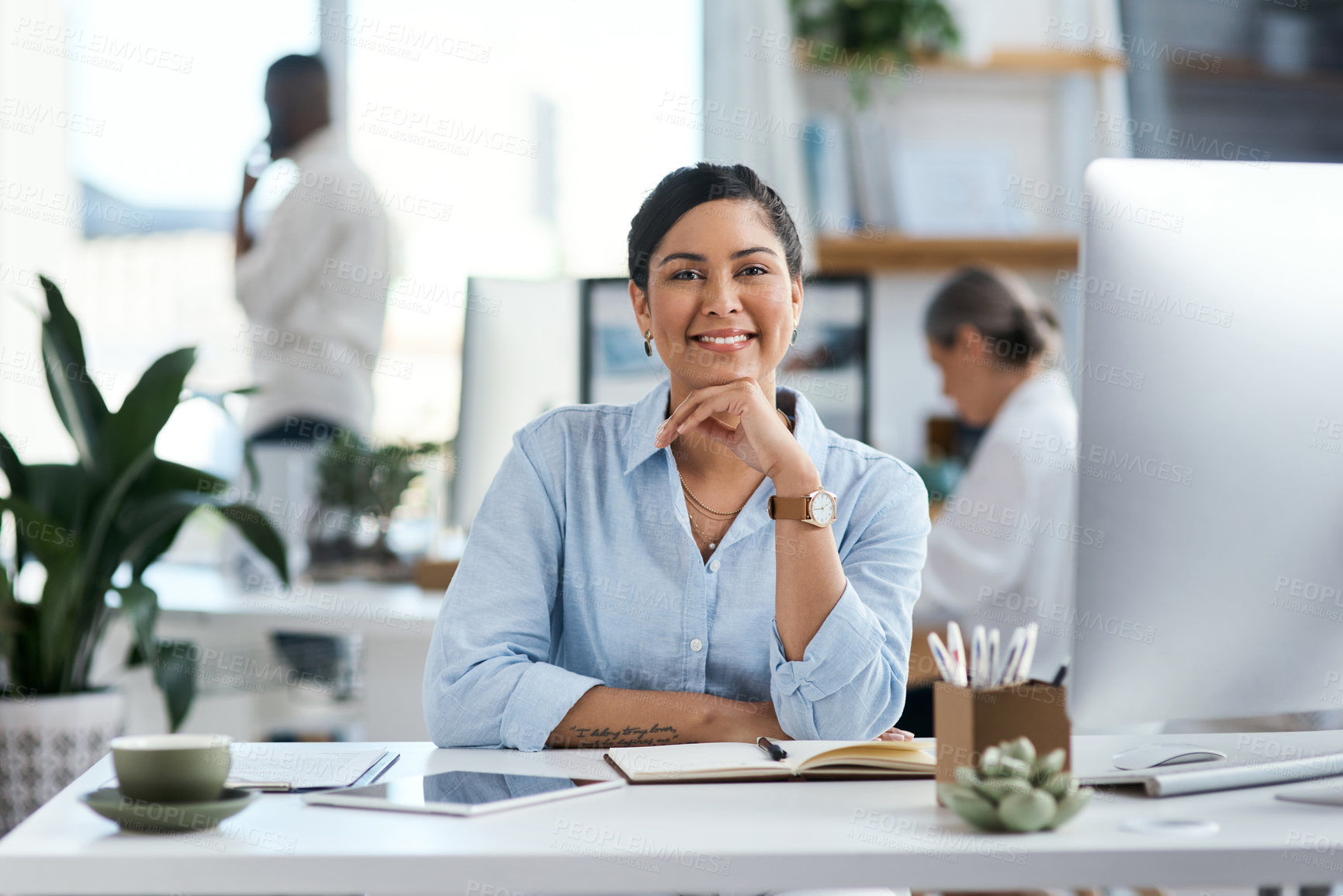 Buy stock photo Portrait of a confident young businesswoman working in an office