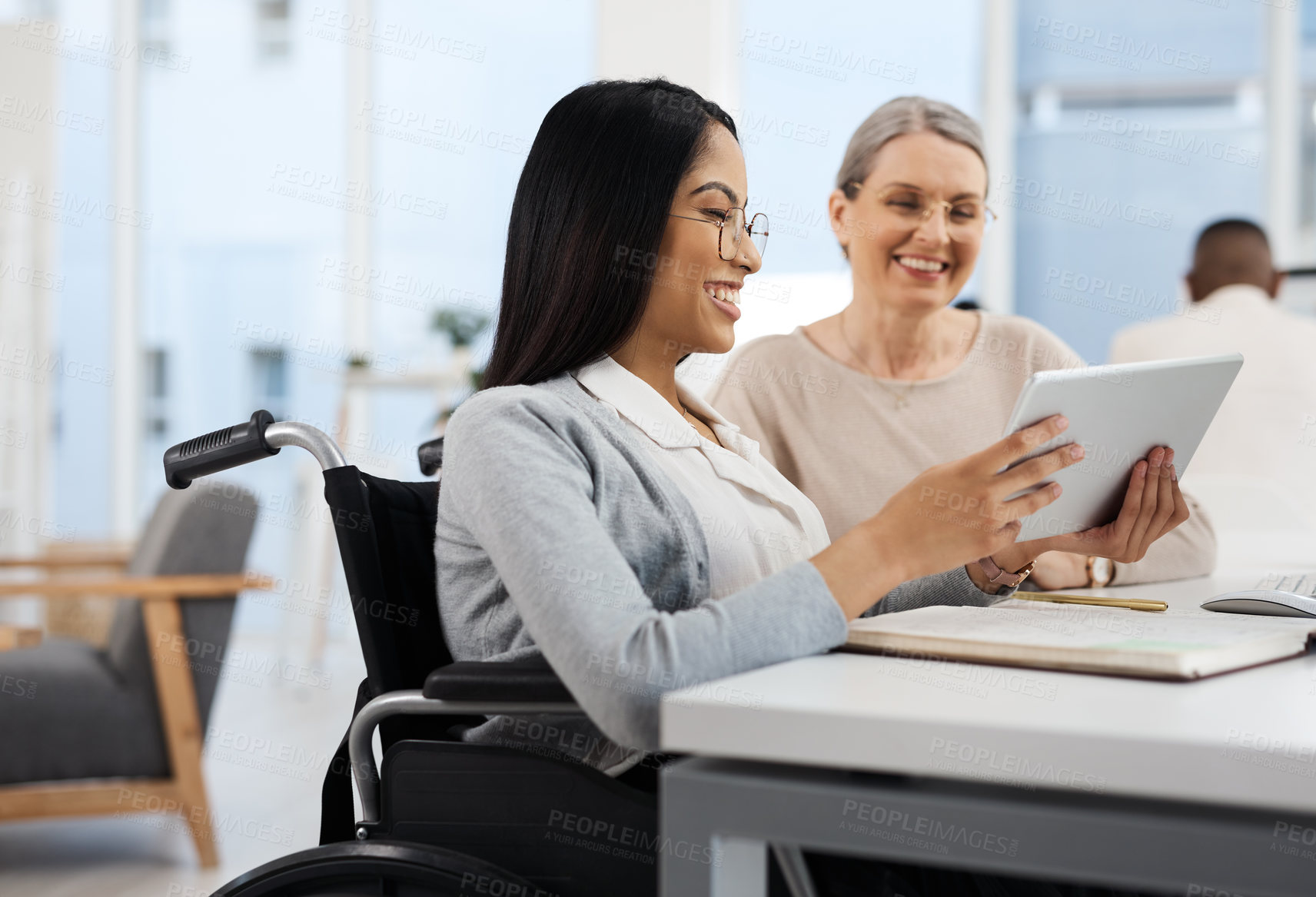 Buy stock photo Cropped shot of an attractive young businesswoman getting some information from her human resources manager in the office