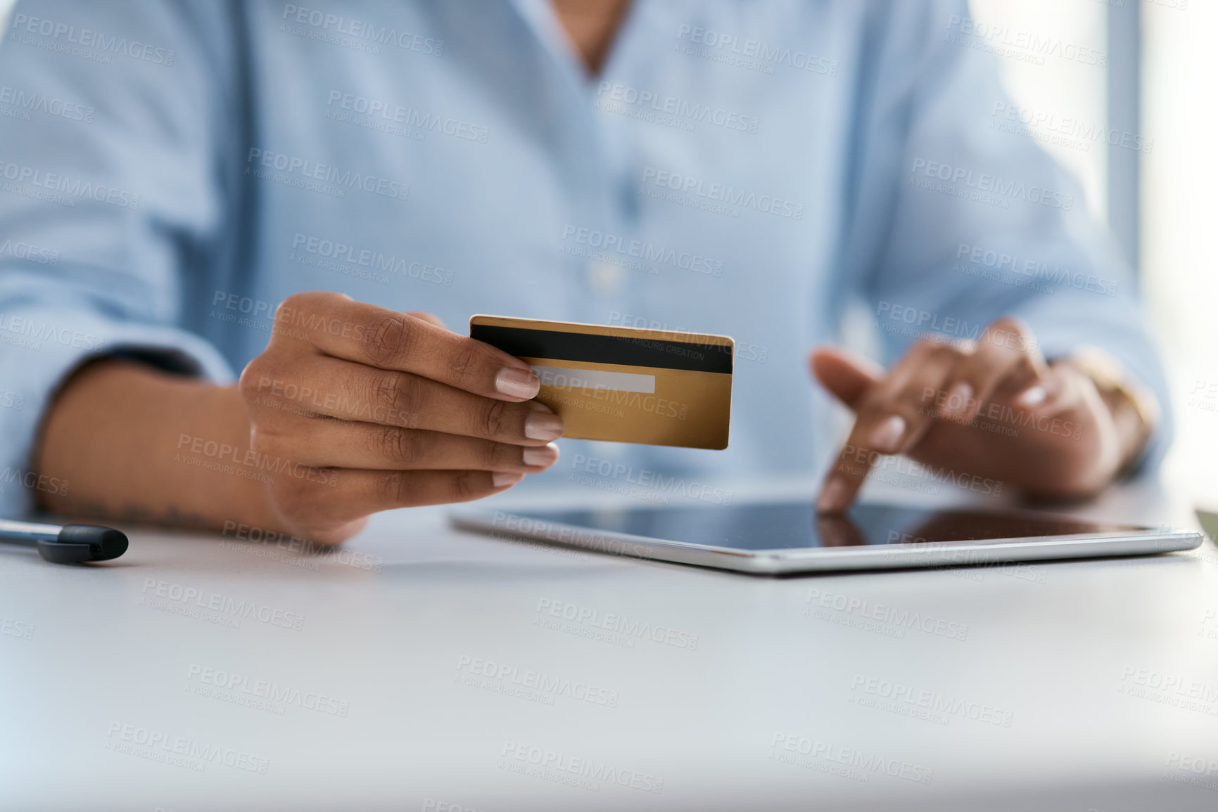 Buy stock photo Closeup shot of an unrecognisable businesswoman using a digital tablet and credit card in an office