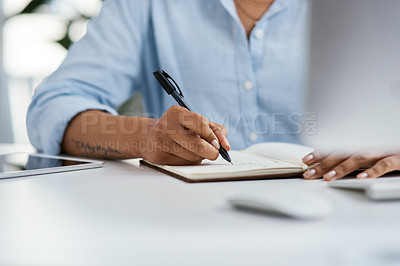 Buy stock photo Closeup shot of an unrecognisable businesswoman writing notes in an office