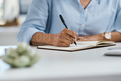 Buy stock photo Closeup shot of an unrecognisable businesswoman writing notes in an office