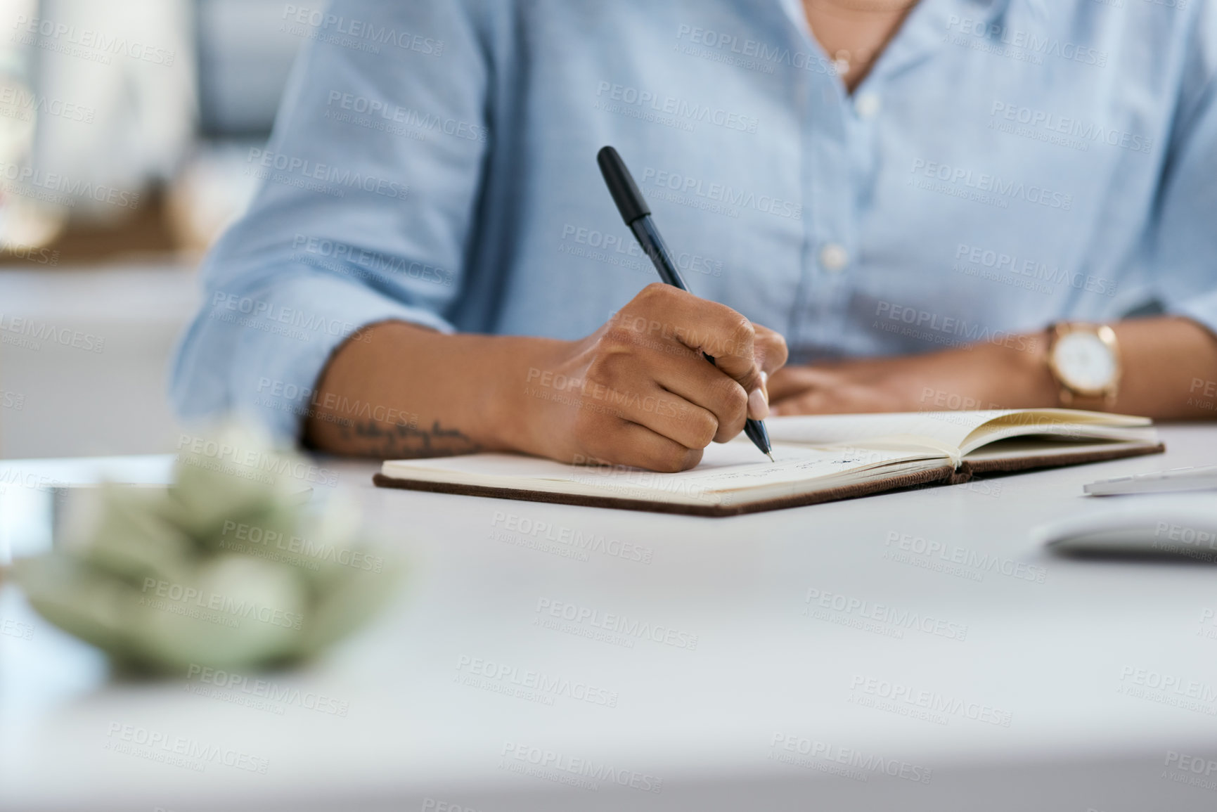 Buy stock photo Closeup shot of an unrecognisable businesswoman writing notes in an office