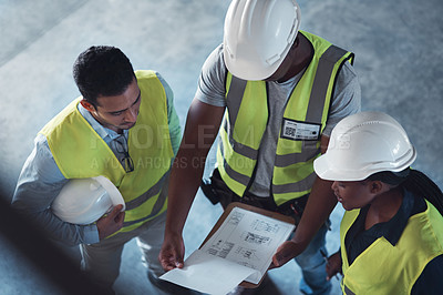 Buy stock photo High angle shot of a group of contractors standing in the warehouse together and having a discussion