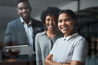 Buy stock photo Shot of three businesspeople working in a modern office