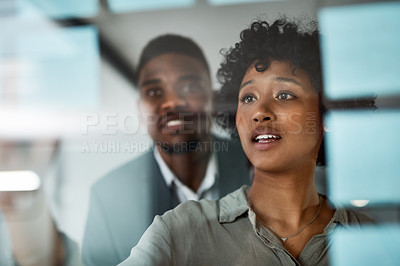 Buy stock photo Shot of Two businesspeople working in a modern office