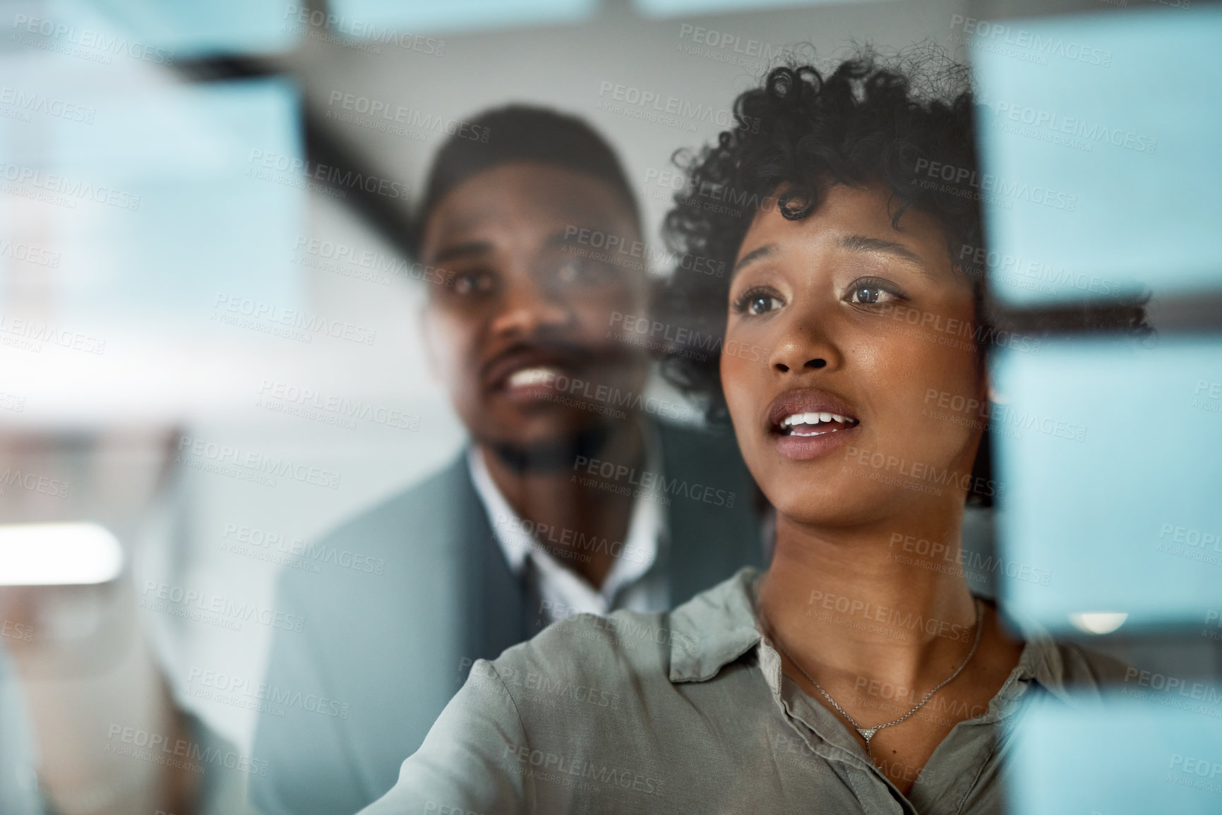 Buy stock photo Shot of Two businesspeople working in a modern office