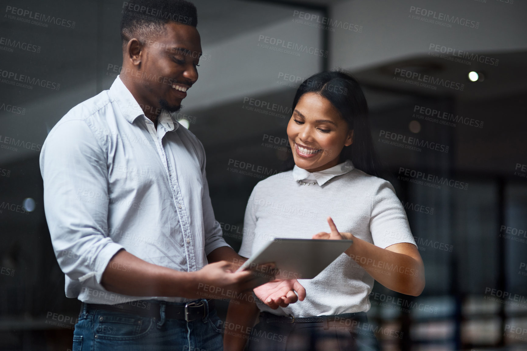 Buy stock photo Shot of Two businesspeople working in a modern office