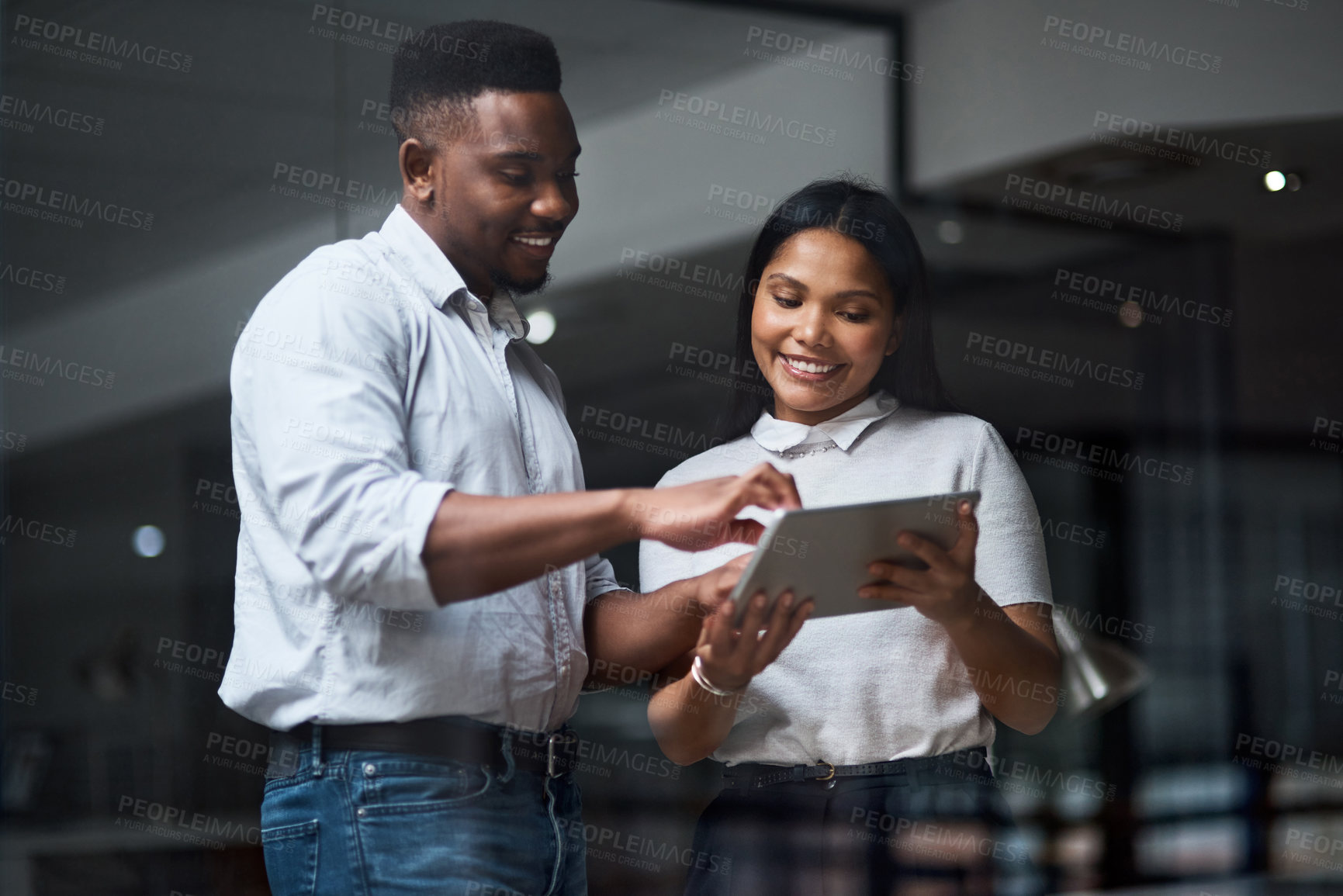 Buy stock photo Shot of Two businesspeople working in a modern office