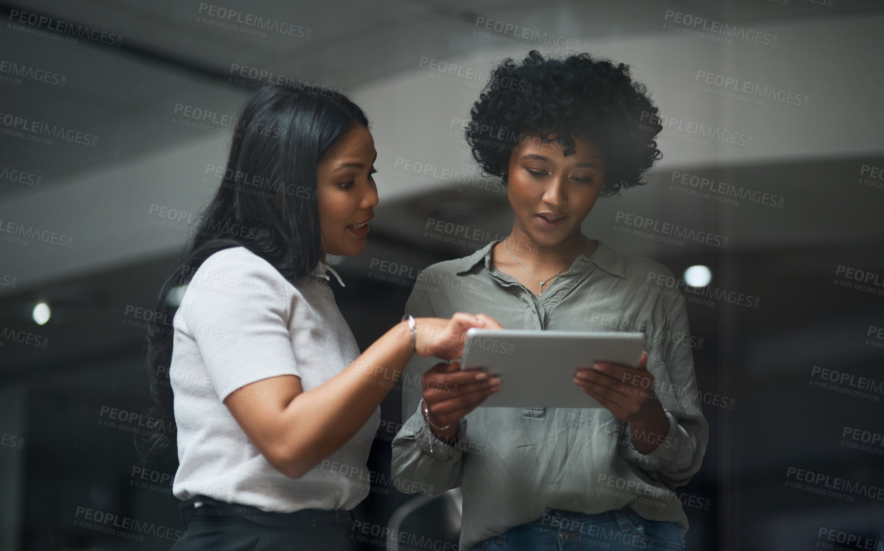 Buy stock photo Shot of Two businesswoman working in a modern office